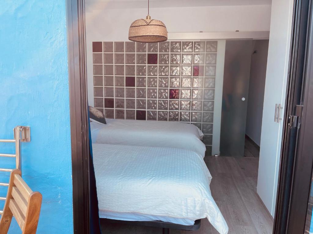 Posteľ alebo postele v izbe v ubytovaní VIVIENDA ÚNICA EN PRIMERA LÍNEA DE PLAYA