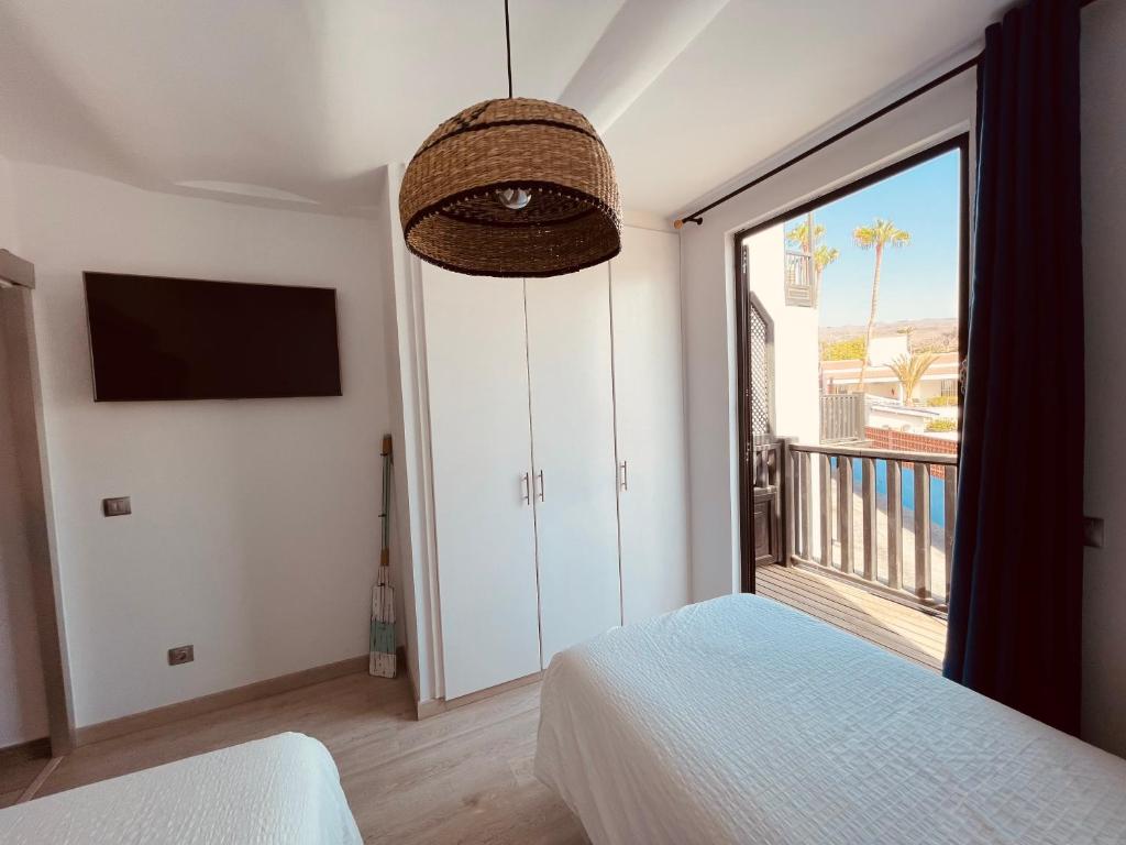 Posteľ alebo postele v izbe v ubytovaní VIVIENDA ÚNICA EN PRIMERA LÍNEA DE PLAYA