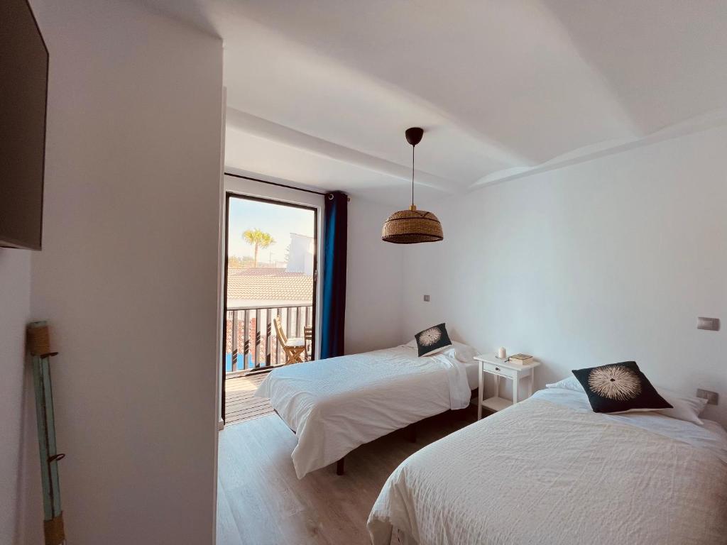 Posteľ alebo postele v izbe v ubytovaní VIVIENDA ÚNICA EN PRIMERA LÍNEA DE PLAYA