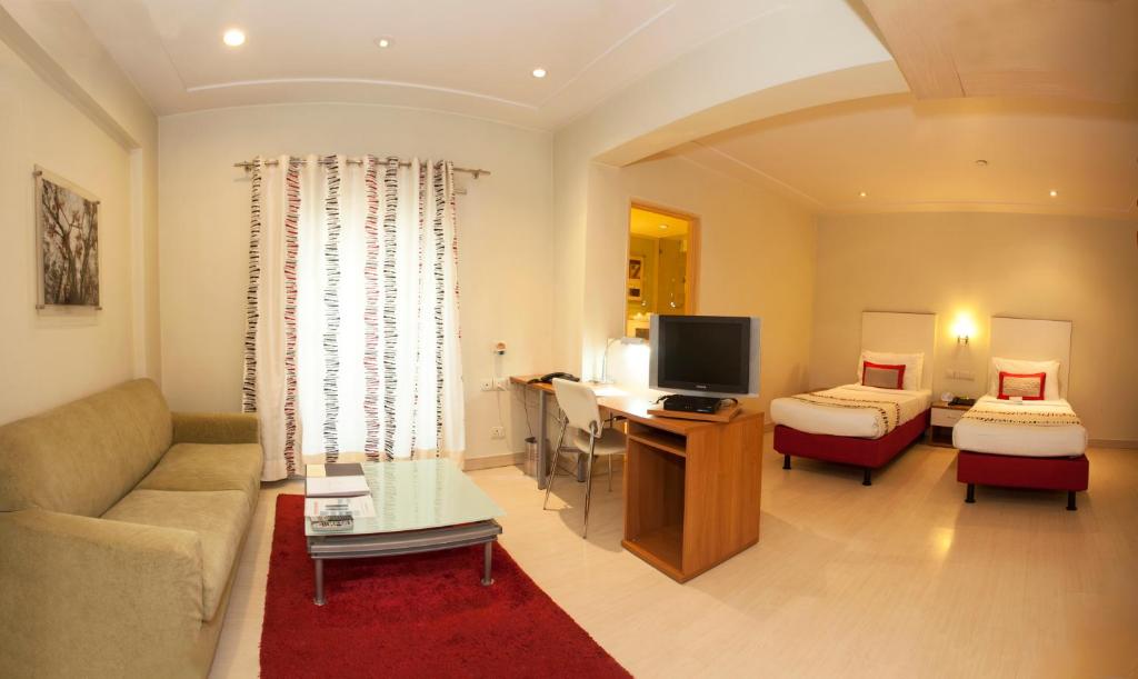 TV a/nebo společenská místnost v ubytování Avalon Courtyard Residence Suites