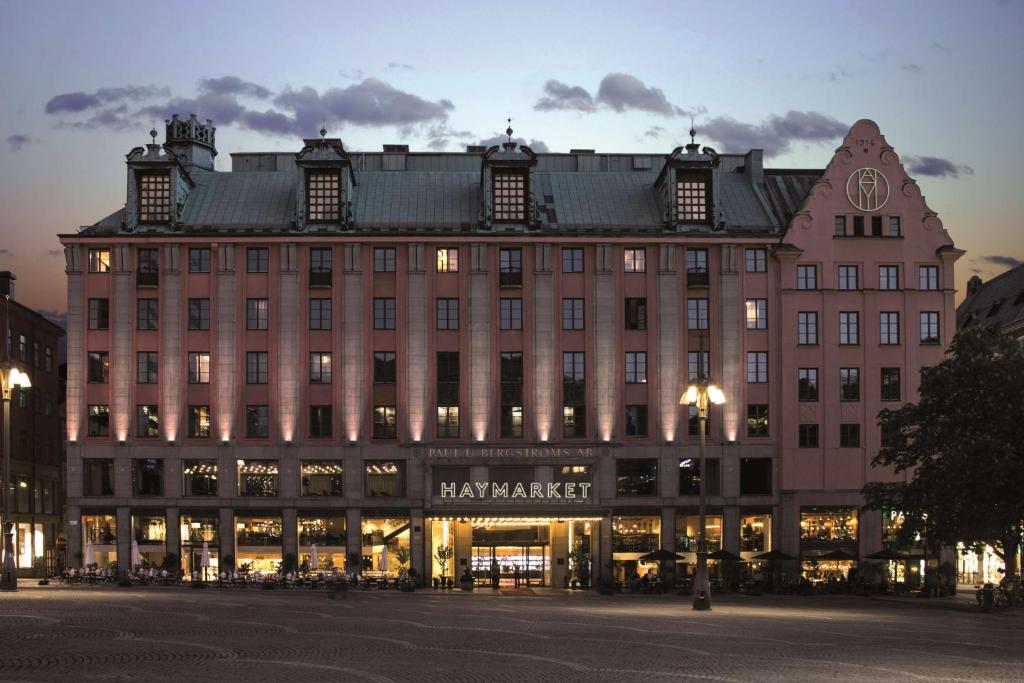 a large building with a clock on the front of it at Haymarket by Scandic in Stockholm