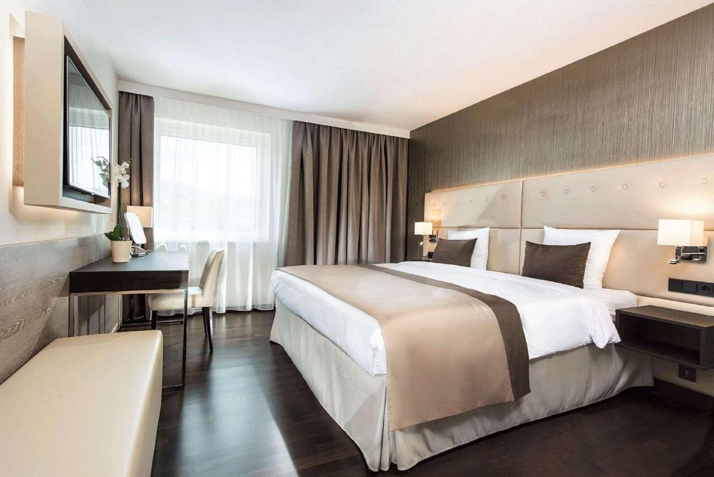 Posteľ alebo postele v izbe v ubytovaní Wyndham Grand Salzburg Conference Centre