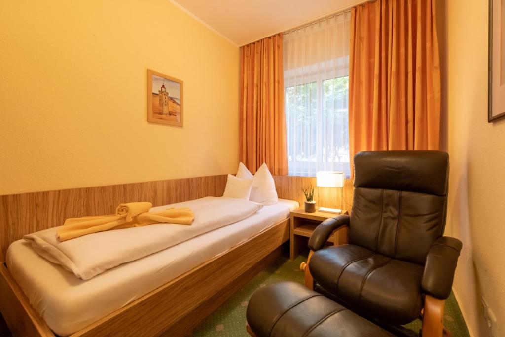 Postel nebo postele na pokoji v ubytování Hotel Zum Steinhof