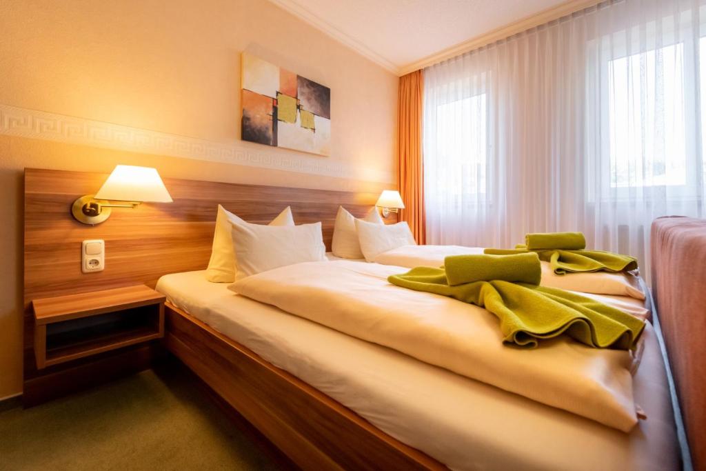 Postel nebo postele na pokoji v ubytování Hotel Zum Steinhof