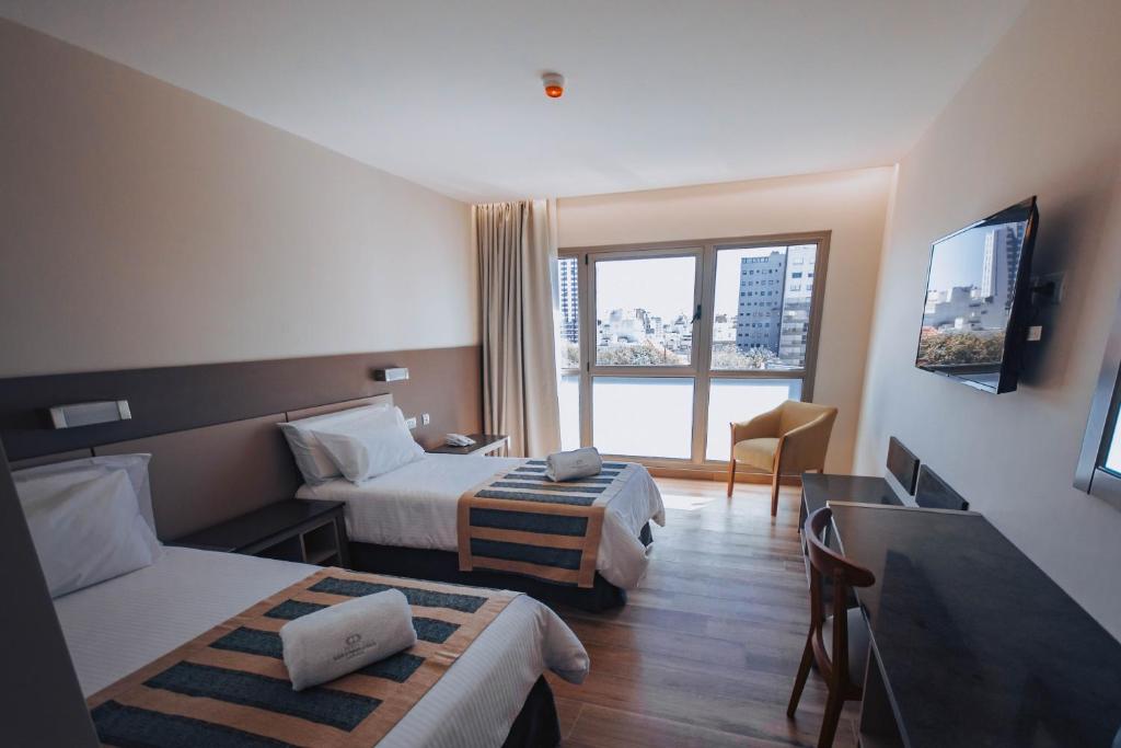 TV a/nebo společenská místnost v ubytování SEC Hotel