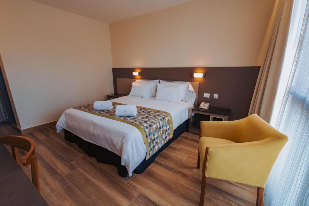 Postel nebo postele na pokoji v ubytování SEC Hotel