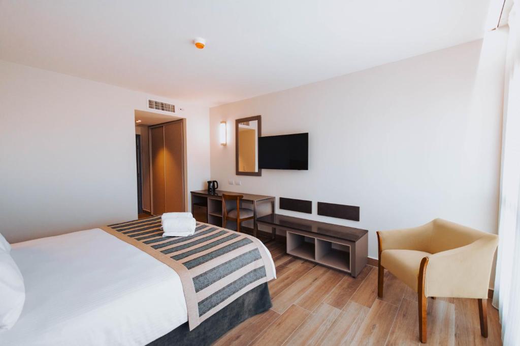 Postel nebo postele na pokoji v ubytování SEC Hotel