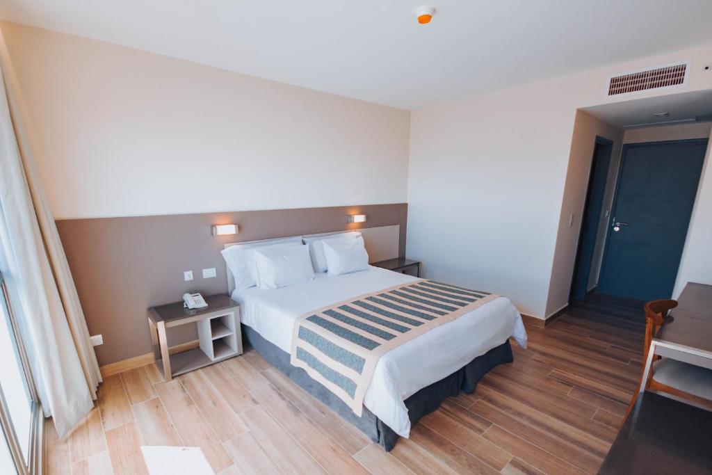 Postel nebo postele na pokoji v ubytování SEC Hotel