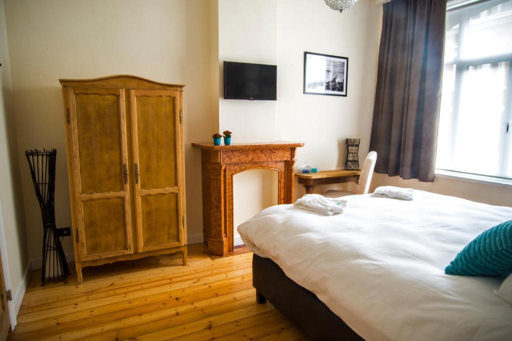 Postel nebo postele na pokoji v ubytování B&B Chambres d'O