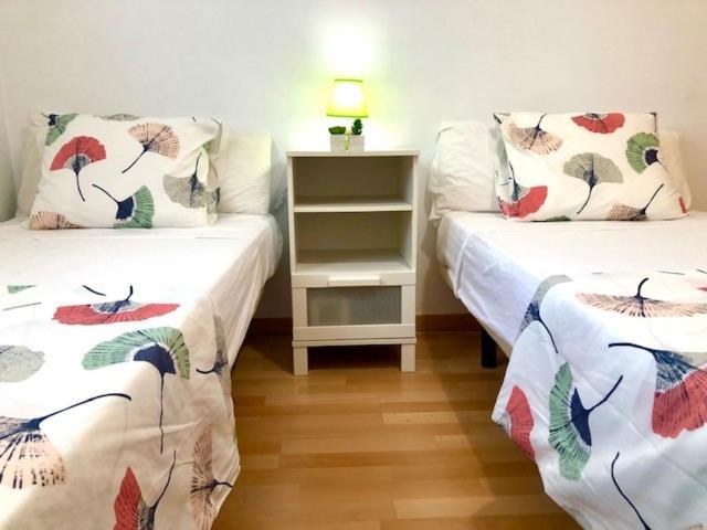Postel nebo postele na pokoji v ubytování GATU PREMIUM Ático Parra, parking, piscina común, terraza, wifi , " Preferente mayores de 25 años y familias "
