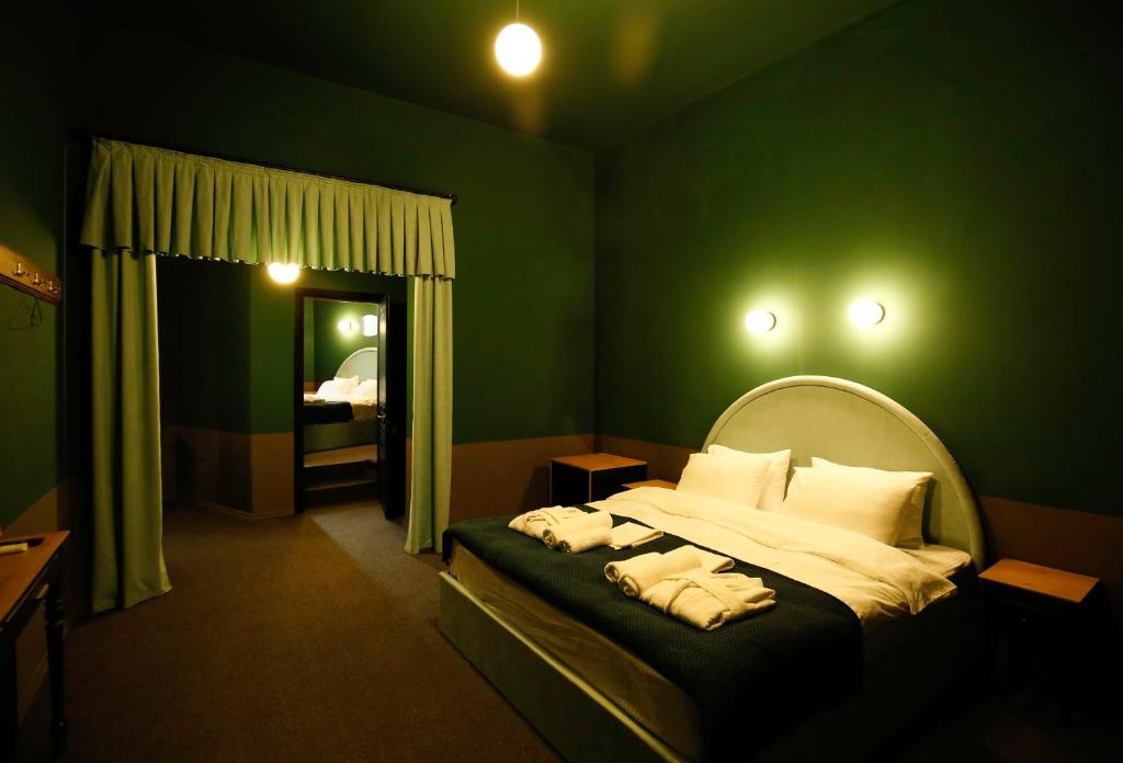 Postel nebo postele na pokoji v ubytování Hotel Memoire Kutaisi