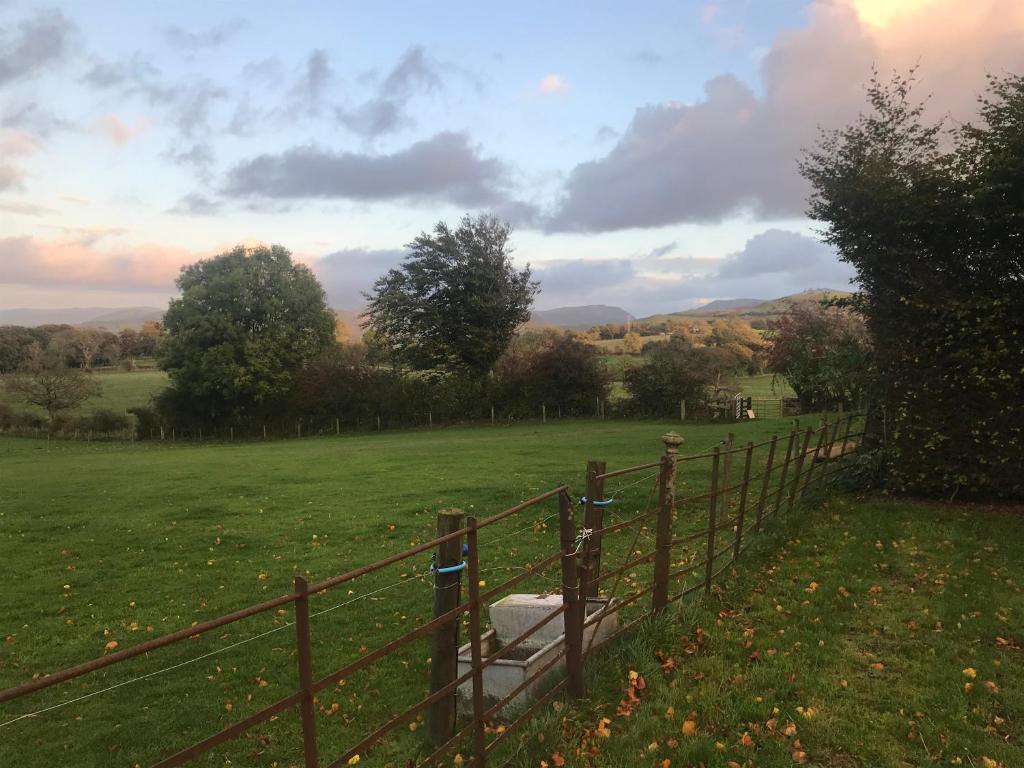 a fence in the middle of a field at 1-Bed studio Apartment nr Cockermouth in Cockermouth