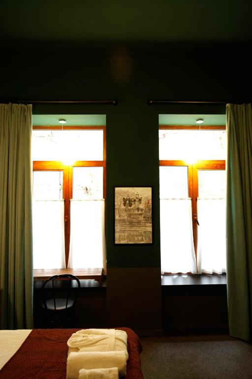Postel nebo postele na pokoji v ubytování Hotel Memoire Kutaisi