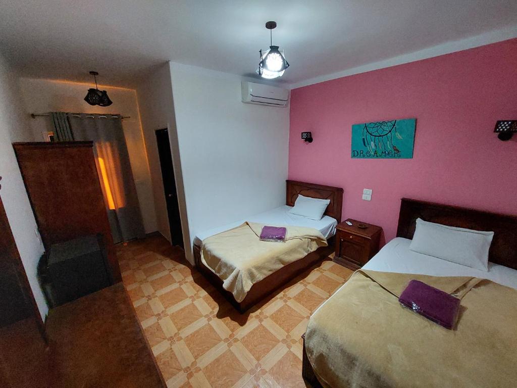 Postel nebo postele na pokoji v ubytování Carmine Hotel Dahab