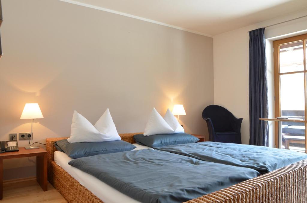 Postel nebo postele na pokoji v ubytování Nebelhorn Relaxhotel