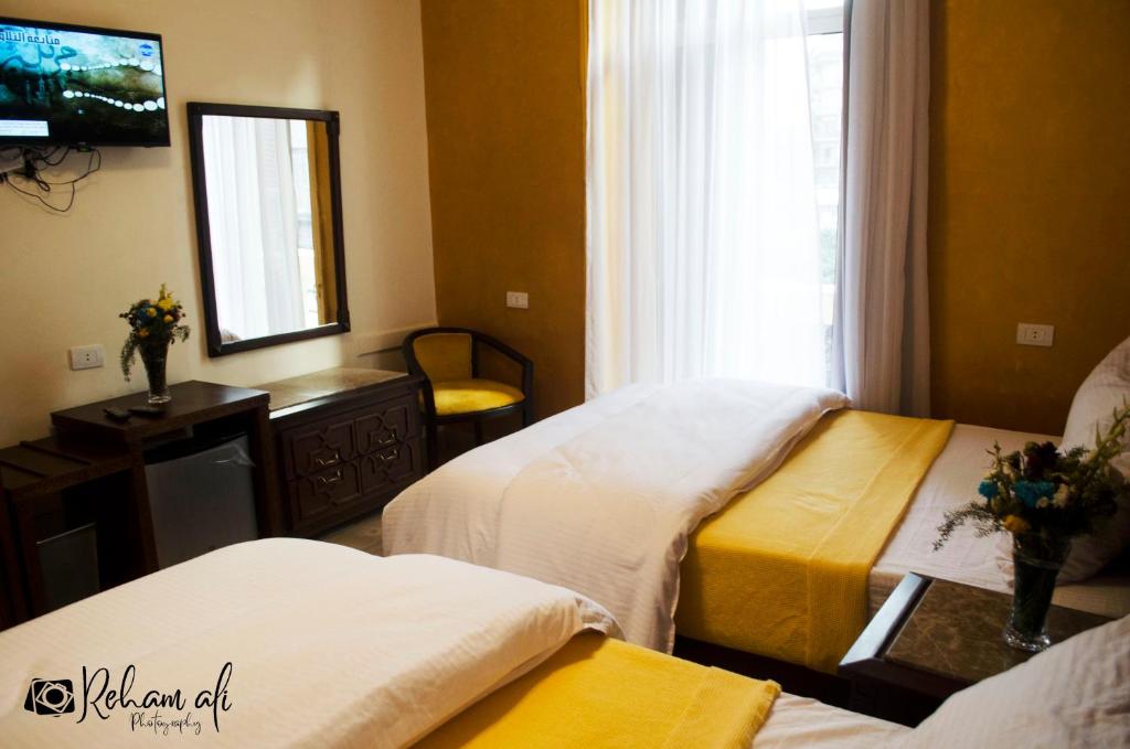Postel nebo postele na pokoji v ubytování The location Hotel