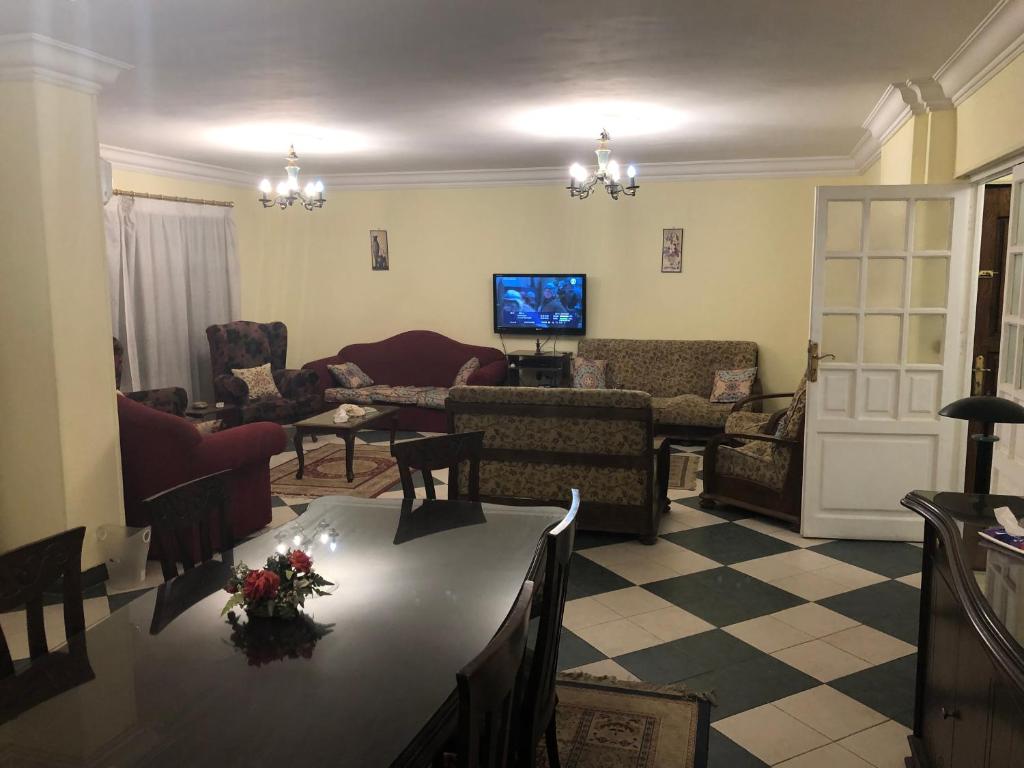 a living room with a couch and a table at Three bedrooms apartment Degla Maadi in Cairo