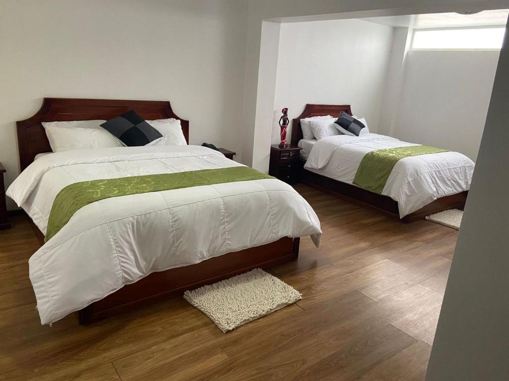 Postel nebo postele na pokoji v ubytování Loreto hotel