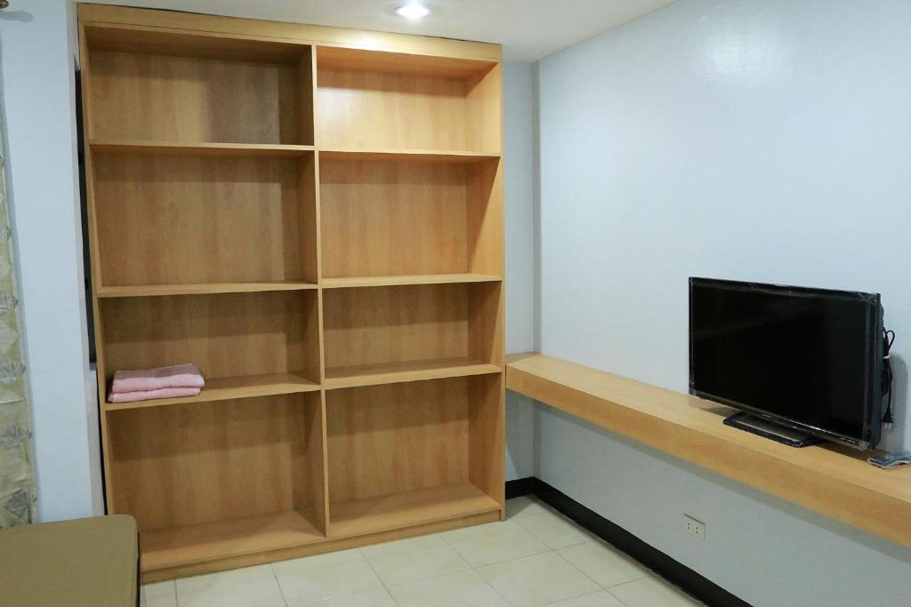 TV a/nebo společenská místnost v ubytování Global 88 Apartelle