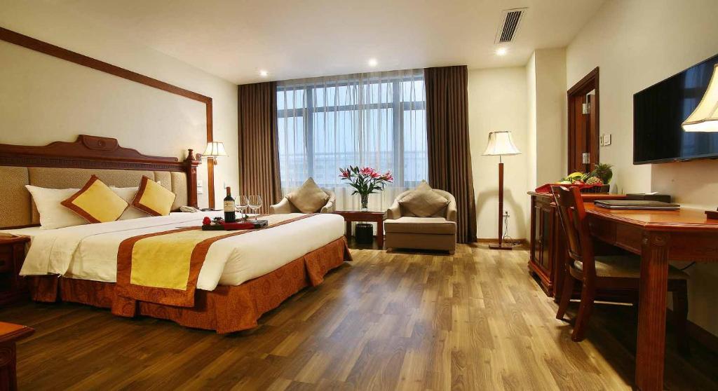 Postel nebo postele na pokoji v ubytování Western Hanoi Hotel