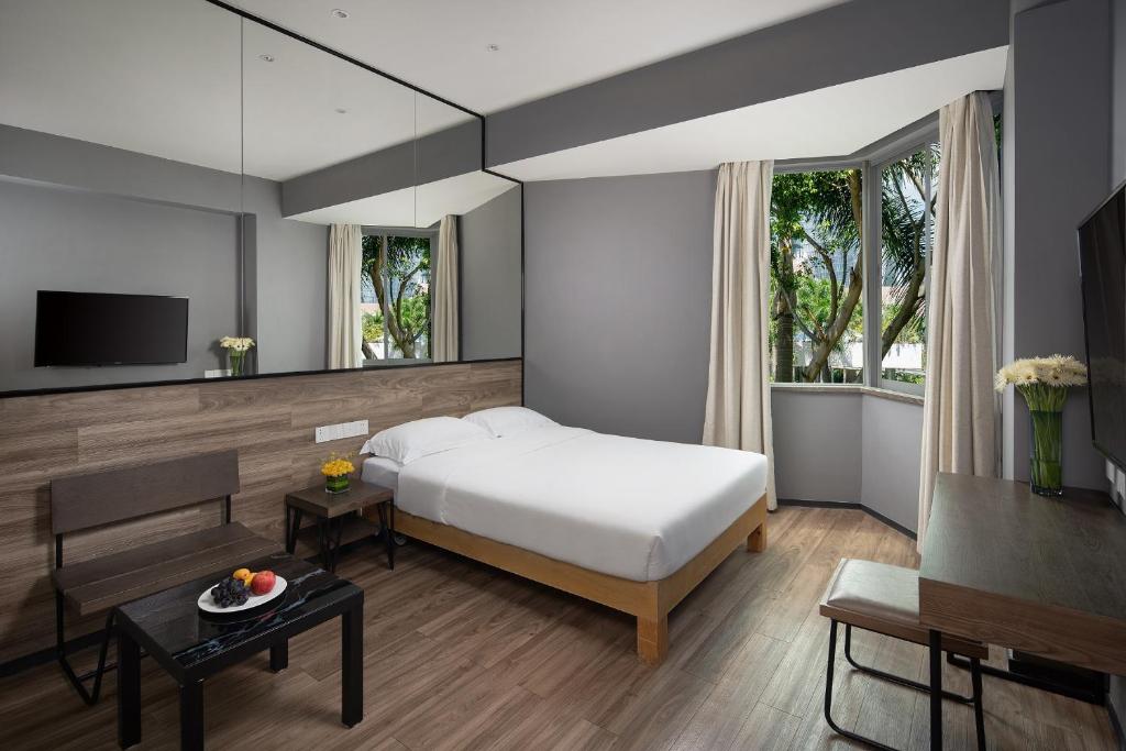 TV a/nebo společenská místnost v ubytování 有集城市客栈锦绣中华店Unijoy Cityinn Splendid China Shenzhen