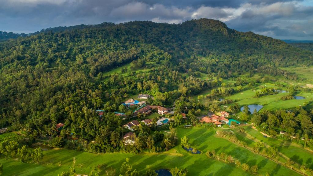 an aerial view of a resort in the mountains at Amritara Ambatty Greens Resort in Virajpet