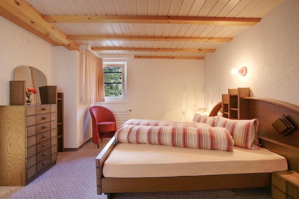 En eller flere senge i et værelse på Hotel Zarera