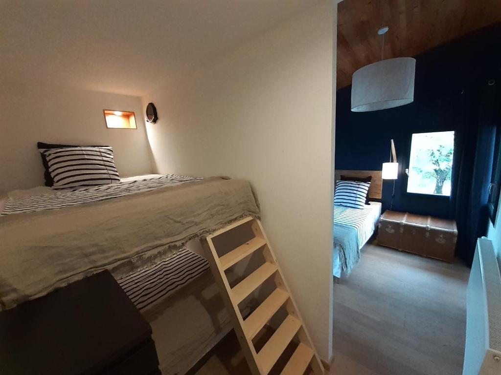 Postel nebo postele na pokoji v ubytování Un je ne sais quoi de Paradis