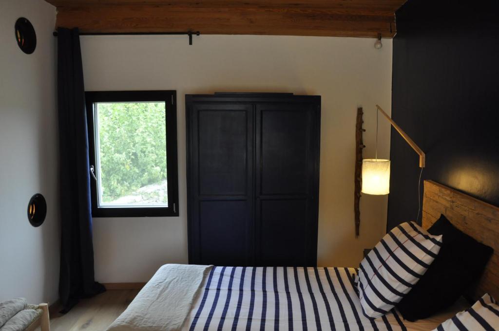 Postel nebo postele na pokoji v ubytování Un je ne sais quoi de Paradis