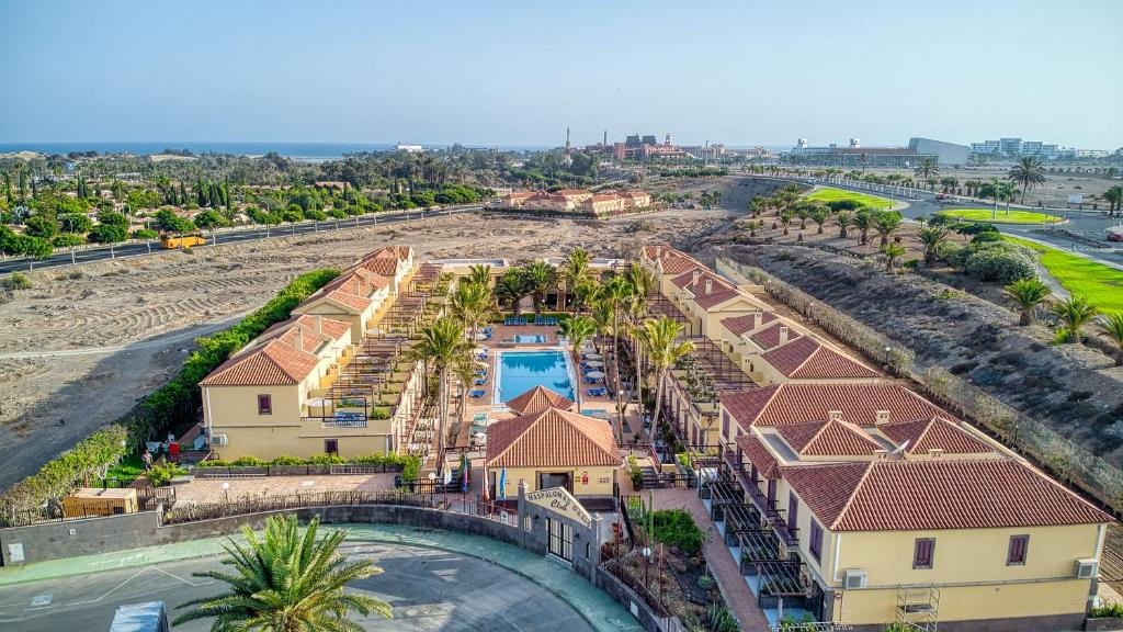 an aerial view of a resort with a swimming pool at Bungalows Maspalomas Oasis Club - All Inclusive. in Maspalomas