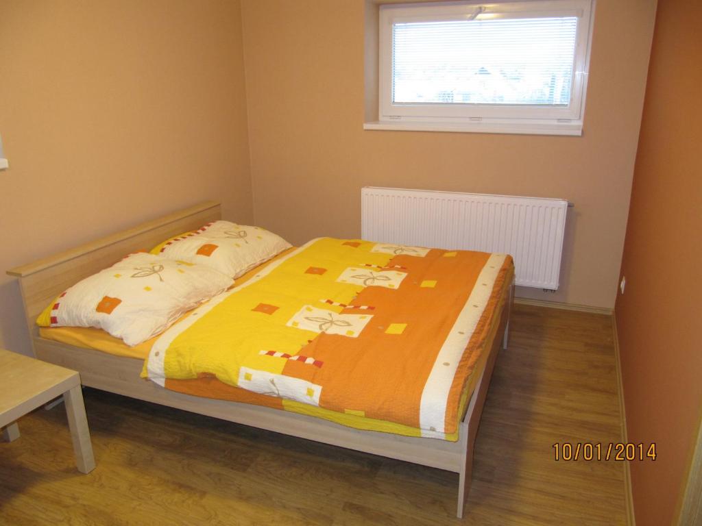 Postel nebo postele na pokoji v ubytování Vinařství Novotný