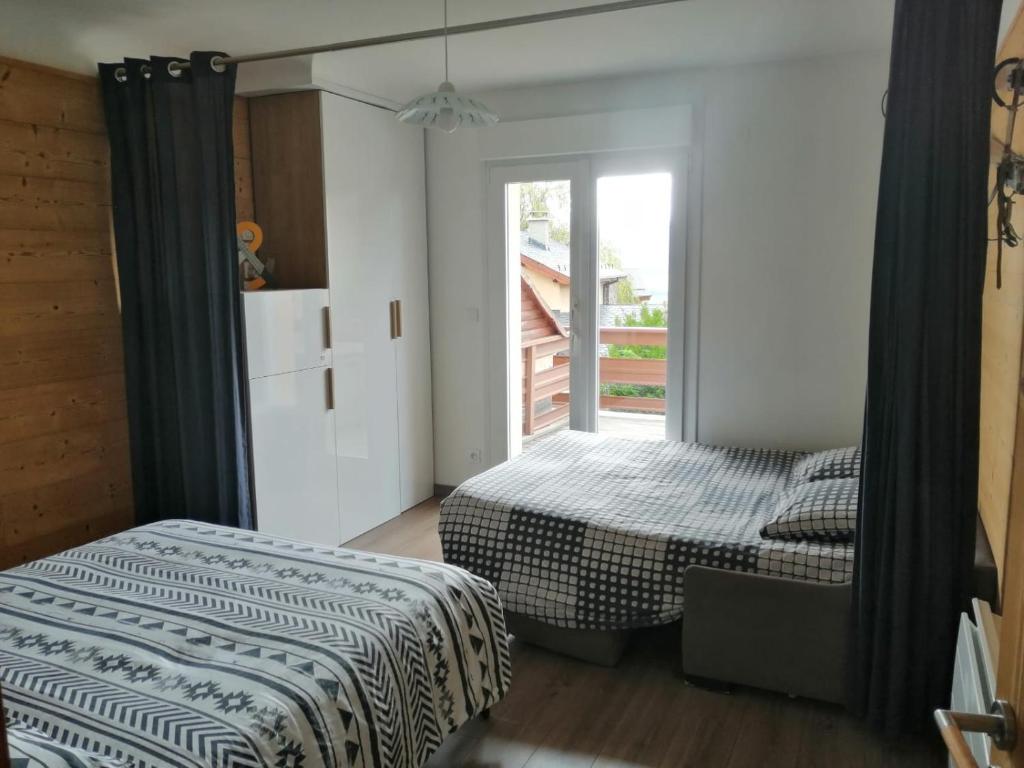 Postel nebo postele na pokoji v ubytování Résidence Campredon - Décoration typique - 25m2 de Terrasse aménagée plein sud avec vue panoramique - Internet - Jardin - Parking - Navette - Linge et Ménage en options payantes