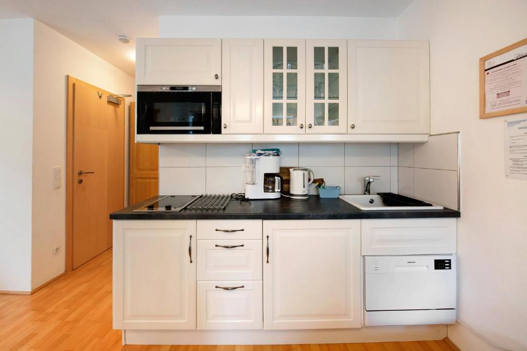 Kuchyňa alebo kuchynka v ubytovaní Haus Lowe Apartment Erdgeschoss 1