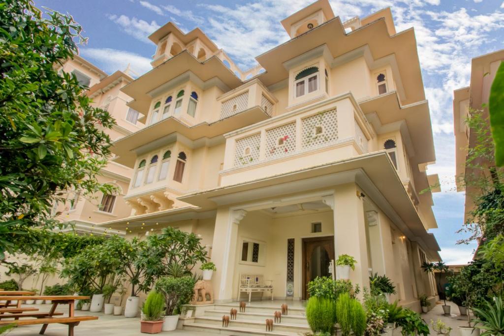 an image of a building with trees at Akshay Niwas Boutique Luxury Hotel in Udaipur