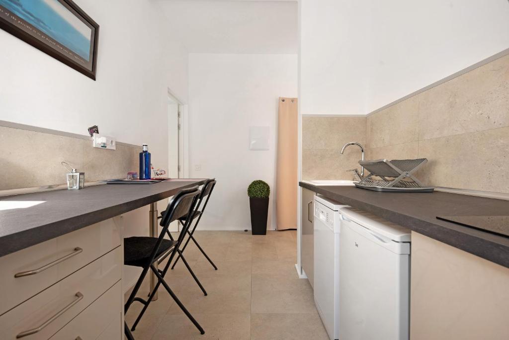 Kuchyň nebo kuchyňský kout v ubytování Apartment Fantastico 4