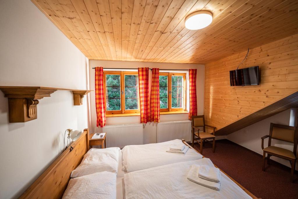 Postel nebo postele na pokoji v ubytování Penzion Panský dům