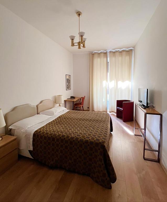 Postel nebo postele na pokoji v ubytování Hotel King
