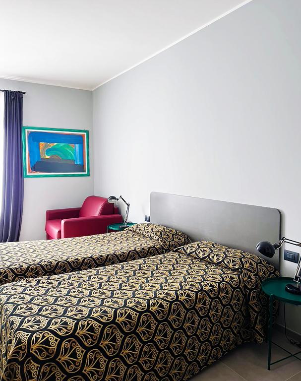 Postel nebo postele na pokoji v ubytování Hotel King