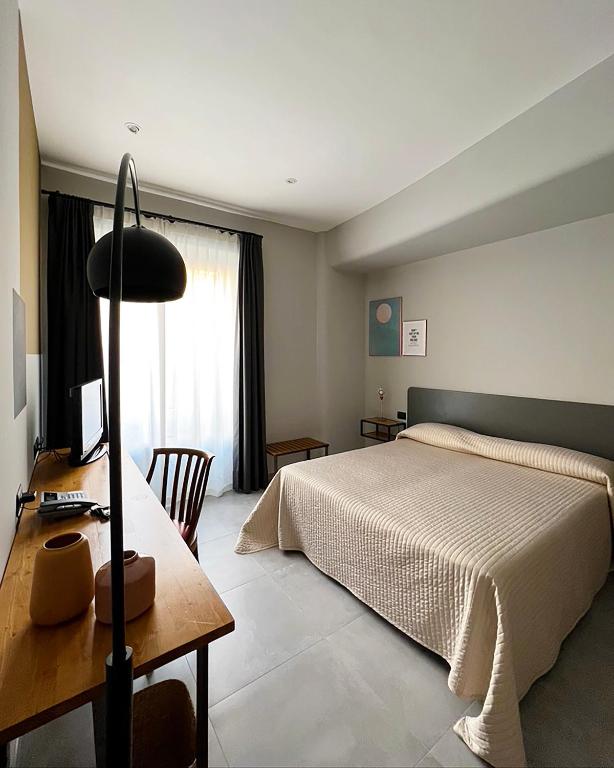 Postel nebo postele na pokoji v ubytování Hotel King