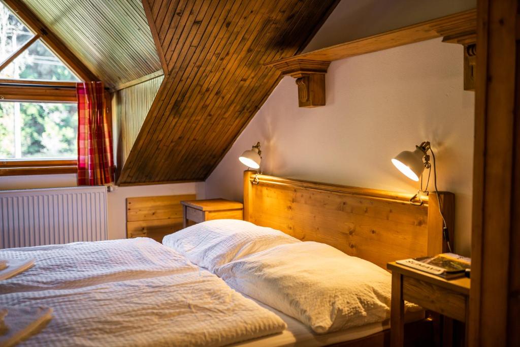 Postel nebo postele na pokoji v ubytování Penzion Panský dům