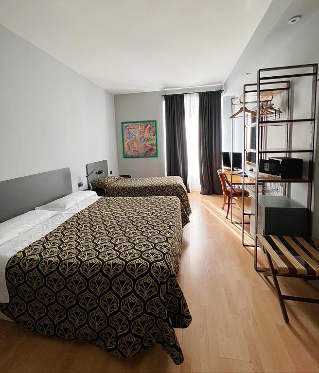 Postel nebo postele na pokoji v ubytování Hotel King