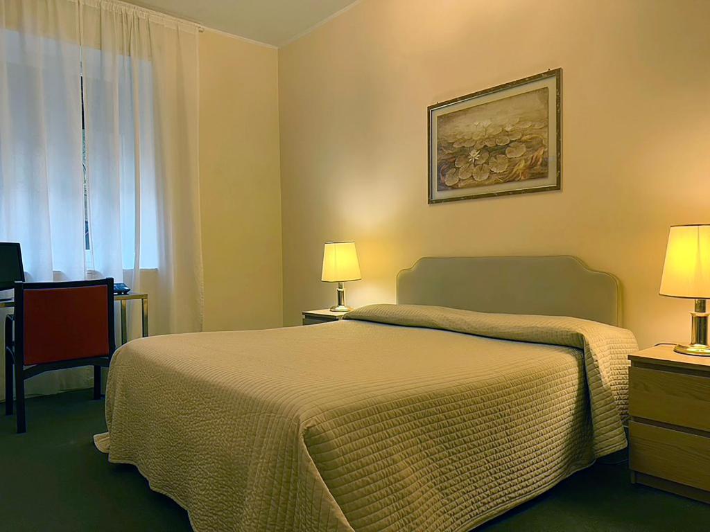 Postel nebo postele na pokoji v ubytování Hotel King