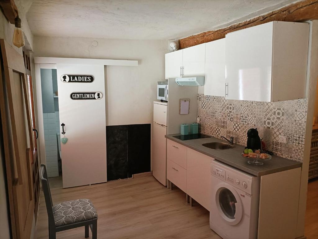 Kuchyň nebo kuchyňský kout v ubytování COMO EN CASA
