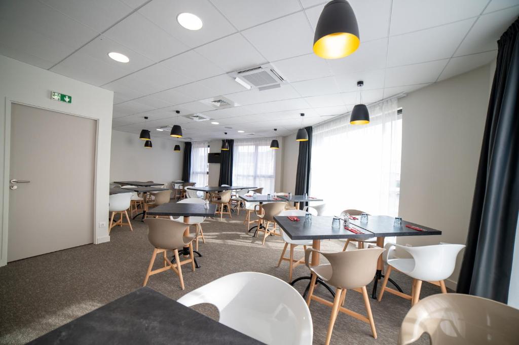 Posezení v ubytování Hôtel - Restaurant Le MITIGANA