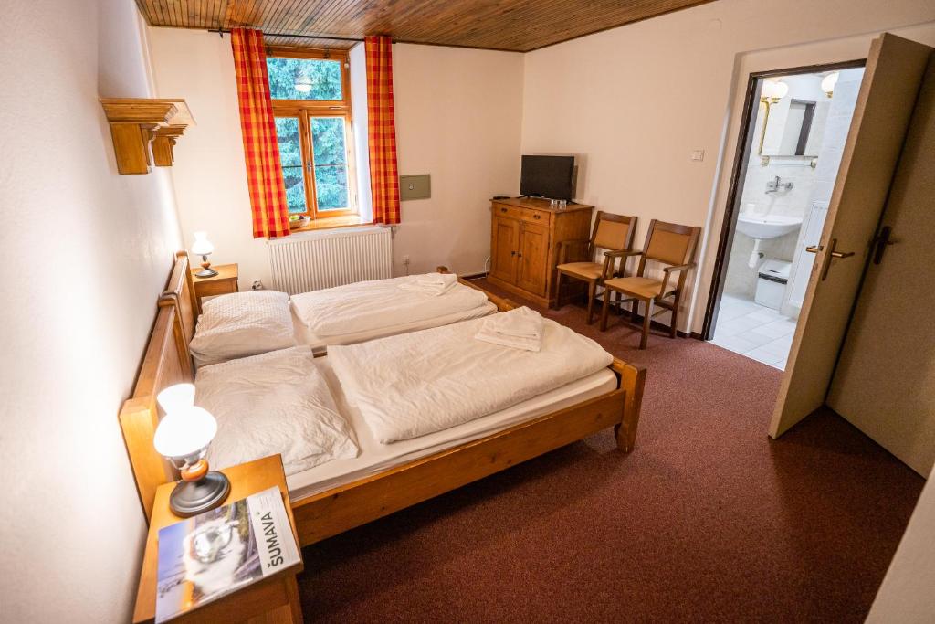 Postel nebo postele na pokoji v ubytování Penzion Panský dům