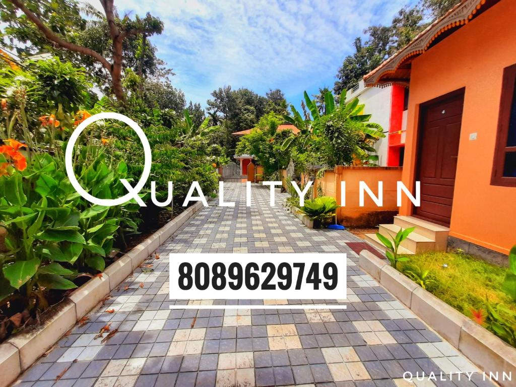 a house with a sign that reads villa in at Quality Inn Varkala in Varkala