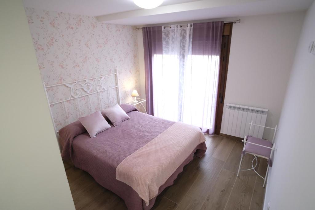 A bed or beds in a room at Amanece Monegrillo Apartamentos