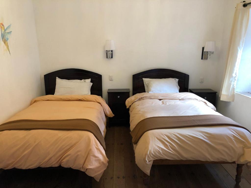 Postel nebo postele na pokoji v ubytování Hostal Qorichaska
