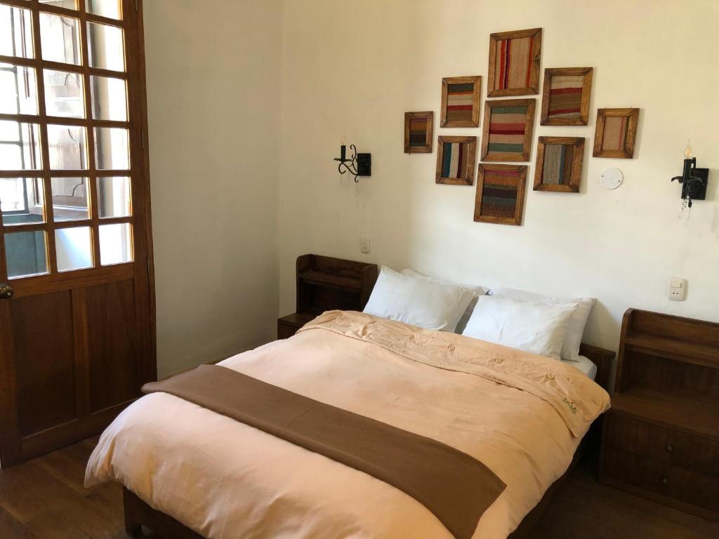 Postel nebo postele na pokoji v ubytování Hostal Qorichaska