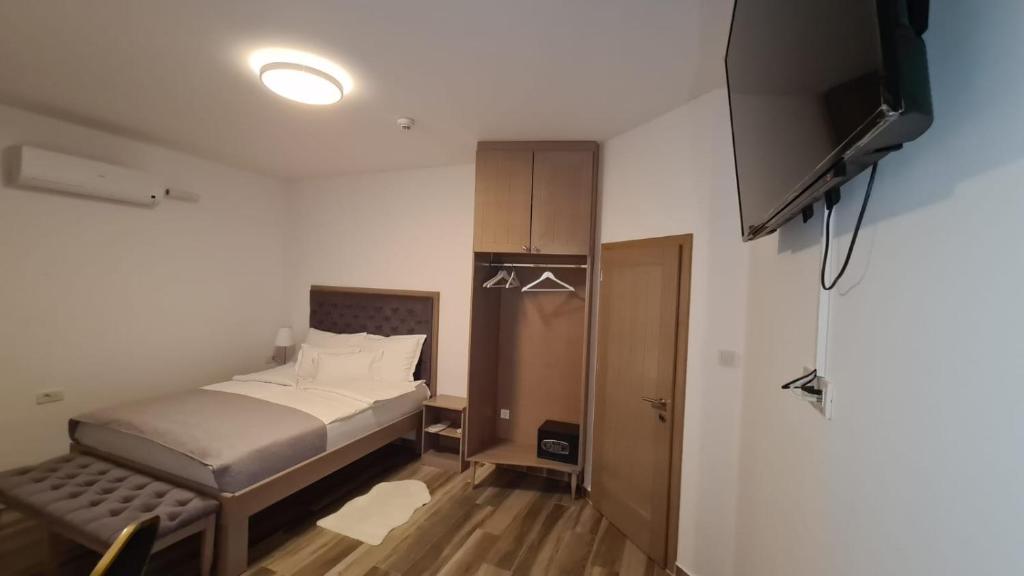 Posteľ alebo postele v izbe v ubytovaní KASNAR ROOMS